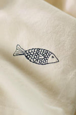 Load image into Gallery viewer, Buttercream Napkin with Fish Embroidery
